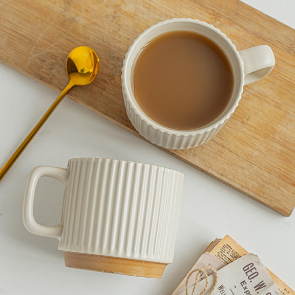 Handcrafted simple clay ceramic mug for drinking coffee at home