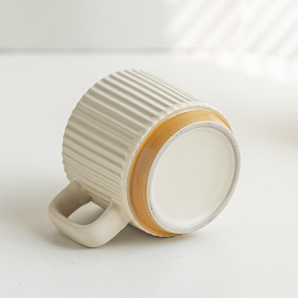 Handcrafted simple clay ceramic mug for drinking coffee at home