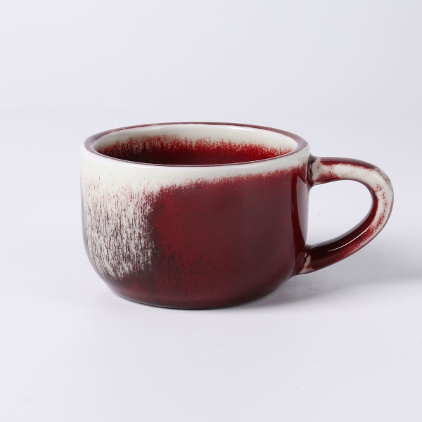 Festive red ceramic cups and plates for European-style afternoon tea or coffee
