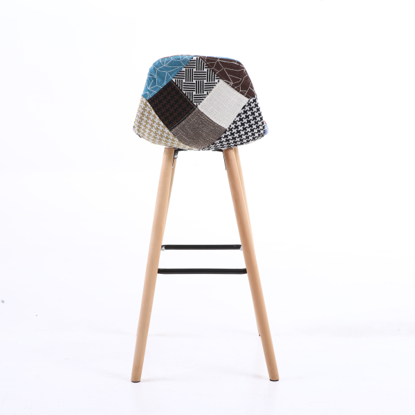 High-quality, modern patchwork bar stool with a wooden bar top and metal legs.